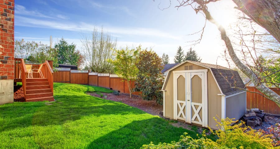 Fenced backyard with storage shed in Kingsport